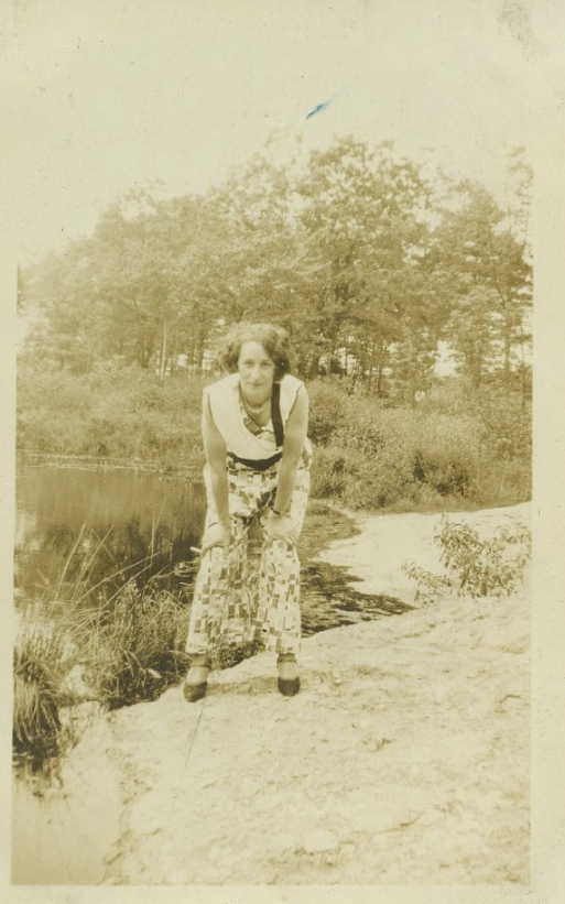Unidentified woman beside a path