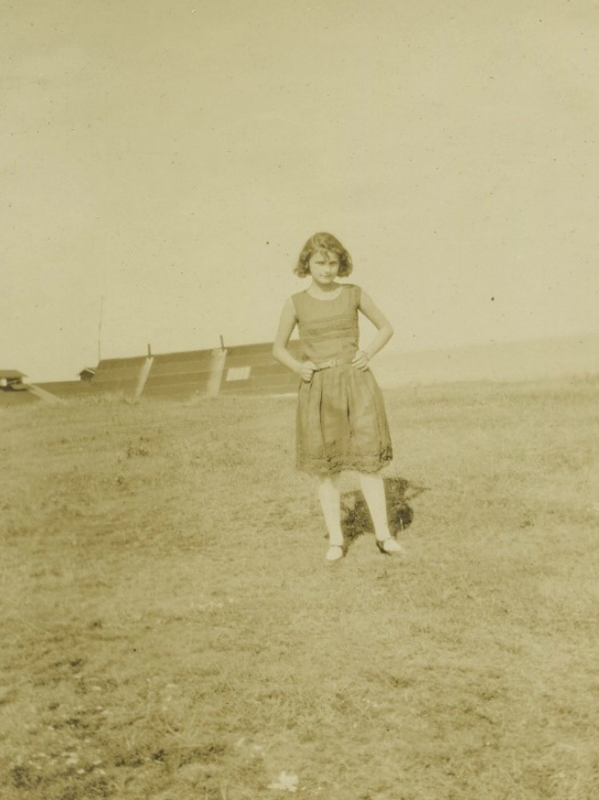 Unidentified woman standing near the shore