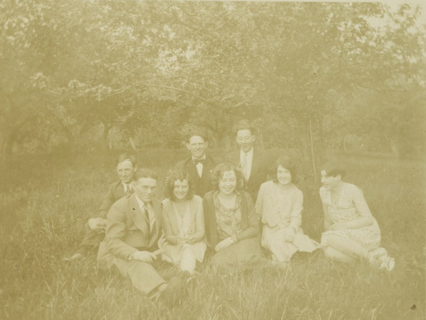 Unidentified group seated outdoors