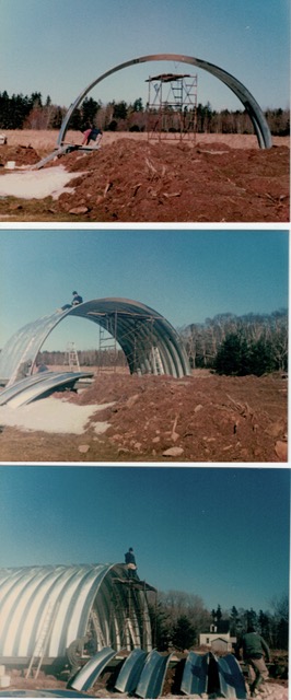 Three colour photographs showing steel arches being raised and clad with corrugated sheets during Fire Department building construction.